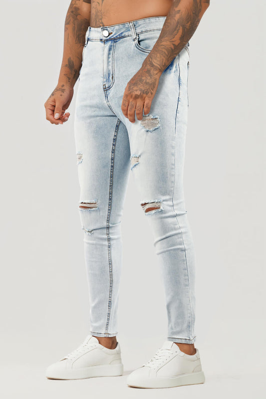 Jeans skinny con strappi al ginocchio da uomo - Blu lavato