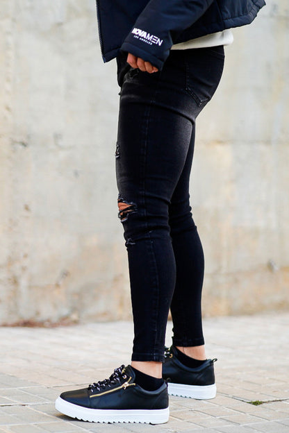 black ripped men's skinny jeans